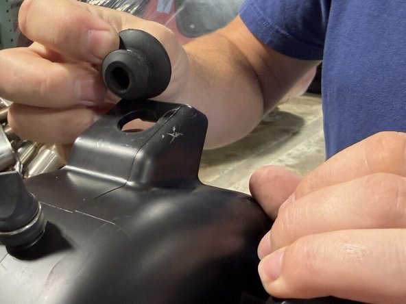 Remove the lower rubber ball stud mount