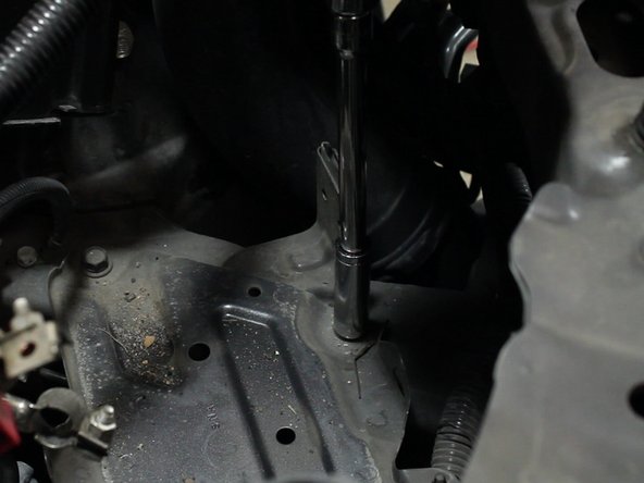 Remove the upper and lower battery tray bolts. There are 4 total.