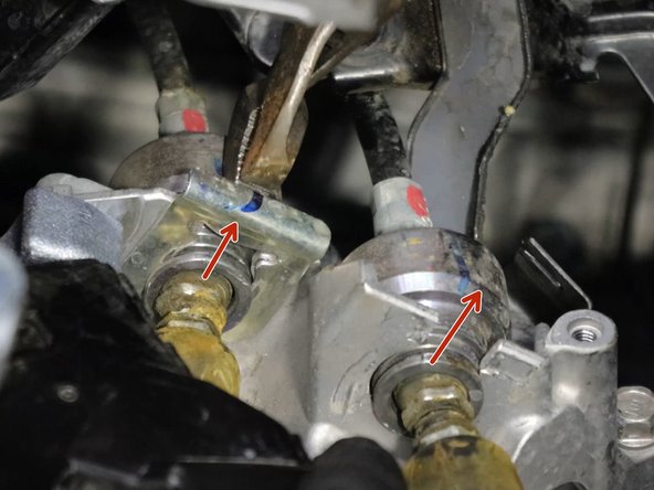 Once they are removed, slide the cables out of the bracket.