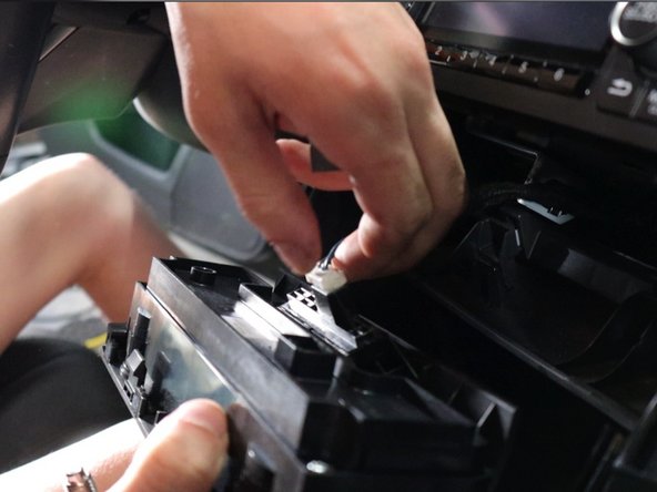 Use your fingers and gently pry the HVAC control panel outward. This will unclip and then you can unplug it.