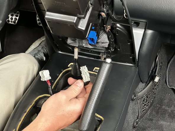 Once the console cover has been unclipped, unplug the wiring connectors.