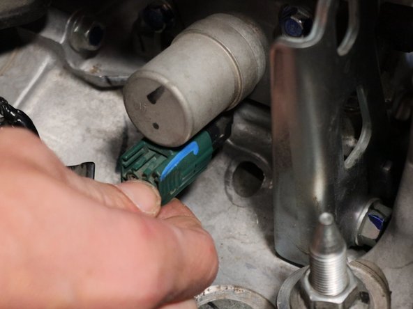 Locate the reverse solenoid on the top of the transmission and unplug the green connector.