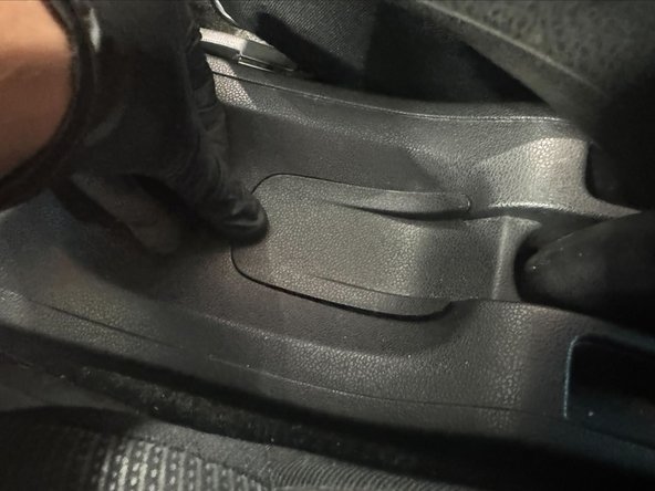 Clip the hand brake cover into place.