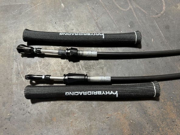 From the shifter side of Cables, push the fiberglass heat sleave on to cables.