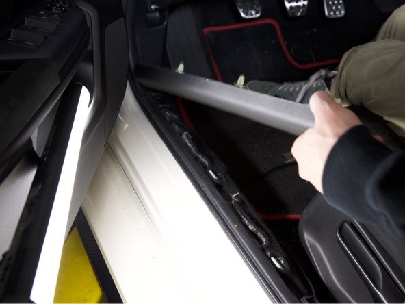 Gently pull upward on the sill cover.