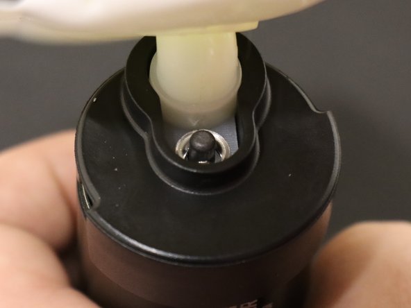 If you can push it on with your hands, do that before using a hammer. Be careful not to break anything. Tap gently.