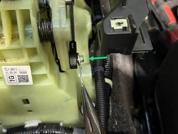 Remove the cotter pin and slide the cable off the stud on the shifter.