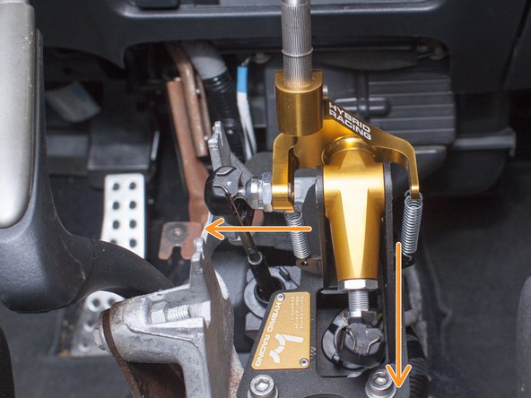 First, loosen the binding nut on the post with the 17mm wrench while holding the post with a 12mm wrench. Next, extend the length of the end-link by threading out the post as illustrated by the orange arrow in the first image.