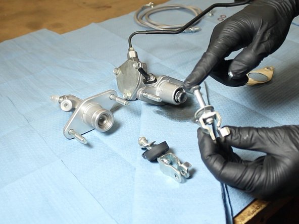 Be sure to grease the rod before inserting it into the EM1 CMC. You can use some of the grease that is on the CMC, or supply your own.