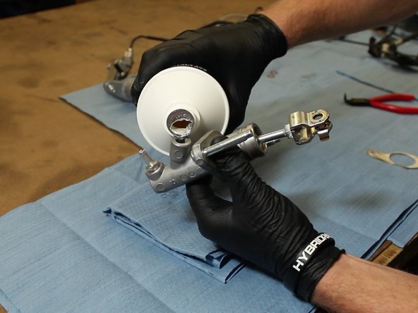 Once the EM1 CMC has the correct rod/fork, fill it with fluid. We recommend DOT 4 brake fluid.
