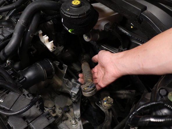 This will remove the cable from the transmission.