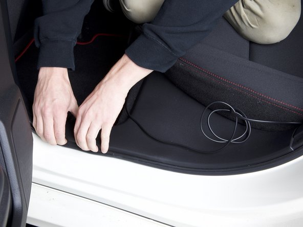 Route the harness through the bottom section of the seat.