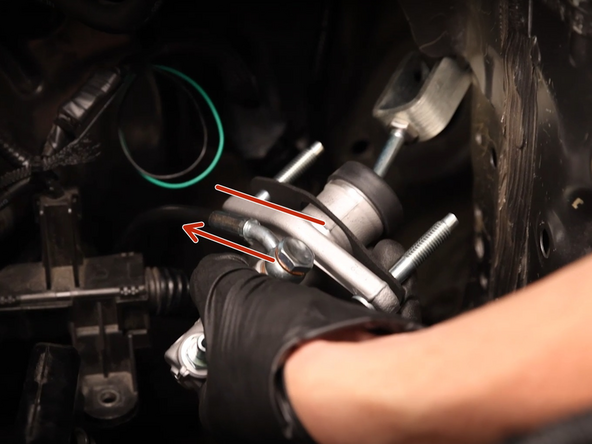 Install the clutch line on the new CMC and make sure it is clocked correctly. The fitting should be in line with the mounting face.