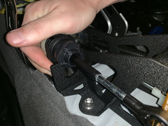 Twist the shifter cable so it slides into the shifter base. Once it is in, rotate it back to lock it into place. Be sure the cable cannot slide out.