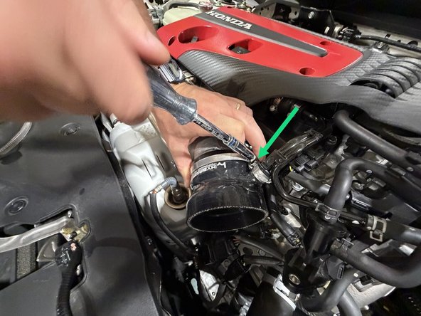 Insert the tube into the inlet and snug the clamp.