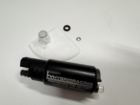 Remove the fuel pump assembly from the vehicle. Be sure to work in a clean, well-ventilated area away from flames. There will be gasoline inside the pump.