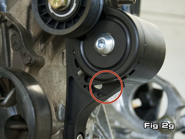 The autotensioner is supplied in its lowest position. Figure 2f shows how no open grooves are visible at the lower portion of the autotensioner. Figure 2g shows the autotensioner adjusted to its highest setting, where 4 grooves are showing. In the case of a k24, typically 2-3 grooves will need to show if the supplied belt is used.