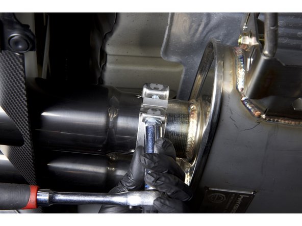 Once the hangers and pipes are tight, tighten the exhaust tips in alignment of the panel.