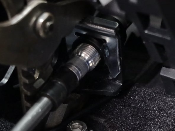 Use the supplied spring clips and install the cables to the shifter. You may need to use an extension or punch.