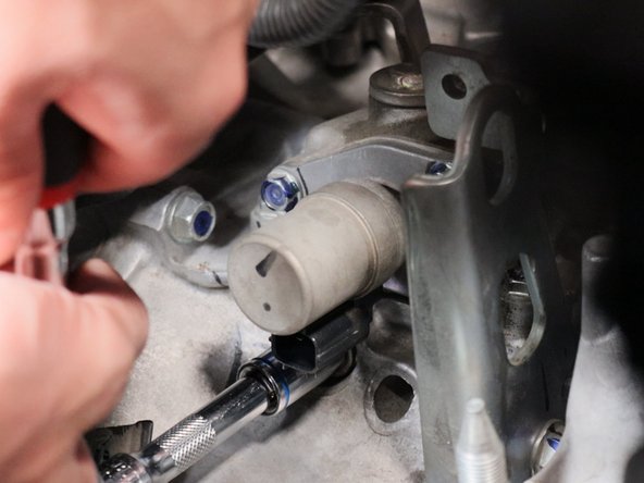 Remove the detent bolt and spring and set aside.