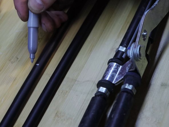 With the cables side by side, mark the position of the shifter cable bracket. You must transfer the cable bracket over to the new HR cables.