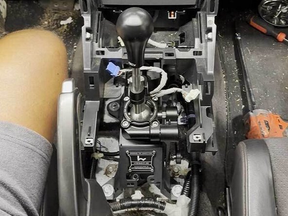 Tighten all four bolts that mount the shifter to your floorboard.