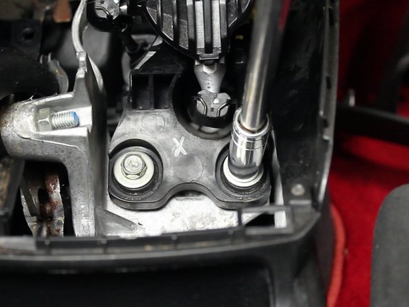 Once the shifter assembly has been fully exposed, remove the 3 mounting bolts.
