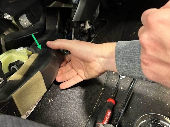 Slide the passenger AC vent back and out of the center of the car.