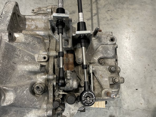 The cables should be completely connected to the transmission at this point.