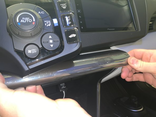 Use your fingers to remove the dash panel from the dash. You may need to use a trim tool to separate it but use your fingers to pry.