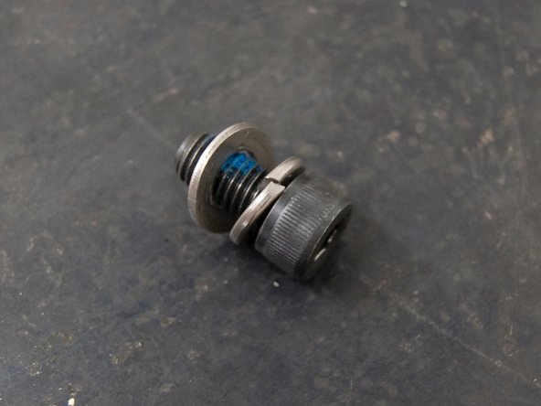 While holding the shifter against the underside of the center tunnel: