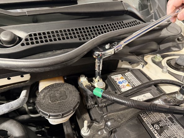 Disconnect the negative battery terminal and tuck the cable away from the post.