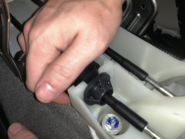 Turn the plastic section of the LH side cable to remove it from the shifter. Once you rotate it, start wiggling it and it will slide out.