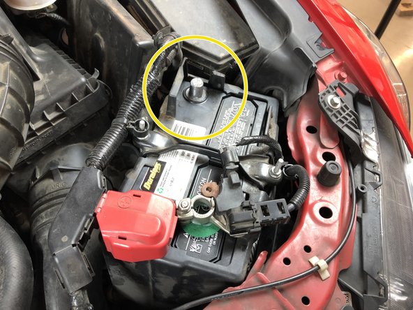 Under the hood, disconnect the battery for safety.