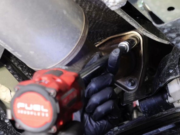 Remove the three bolts on the exhaust flange and slide off the hanger bushing.