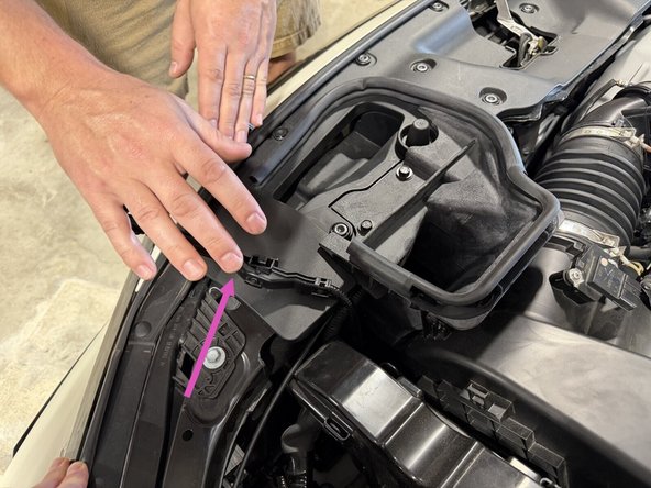 There are a few clips holding the wiring channel to the air cleaner cover. Pop them free with a flat head screwdriver. You come back to the wiring later. If you want to do the wiring now, jump down to the harness steps.