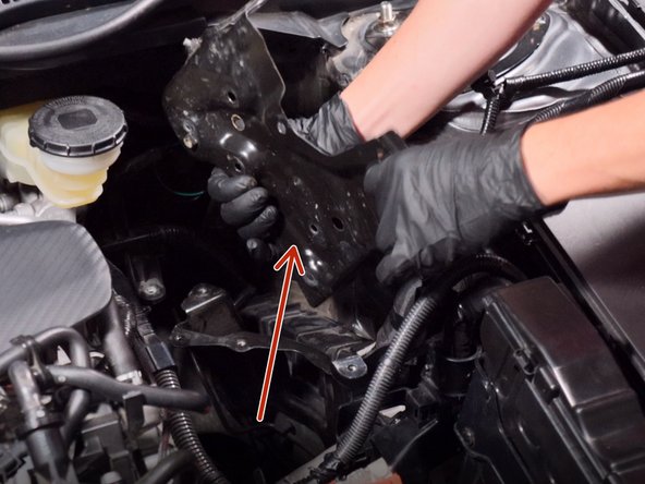 Once the battery tray is unbolted, remove it from the car.