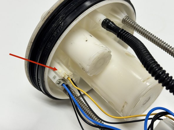 Unplug the fuel level sending unit. It is the connector with the yellow wire.