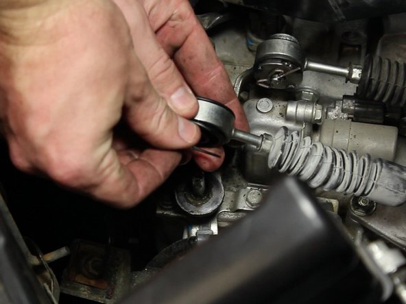 Open the retaining ring and carefully slide into the groove on the bottom of the cable bushing.