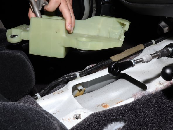 Remove the shifter from the inside of the car.