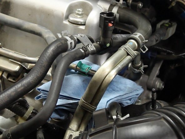 If the vehicle has been running within the past hour, the fuel system could still be holding pressure. When disconnecting the line, be sure to have plenty of towels for any fuel spray or spillage.