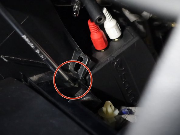 Remove all of the Phillips screws holding the console and coin pocket in place.