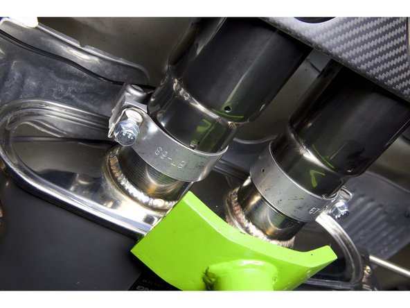 If you are using the blown tips (slant cut) the tip should not rest behind the carbon panel. The tip should stick out slightly to avoid the hot gasses from melting the panel.