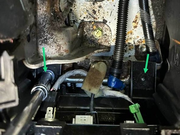 Remove the two console base 10 mm bolts.