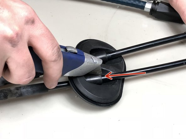 Use a razor blade or knife and slice the cable grommet down the center of each cable.