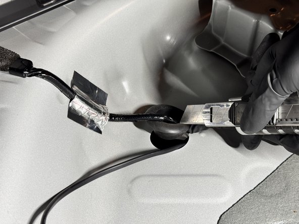 This will allow the EVC wiring to slide through while the grommet it sealed back in place.