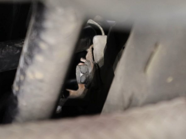 Remove the shifter cable mounting bracket.