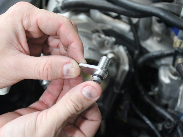 Place the vacuum fitting into the port.