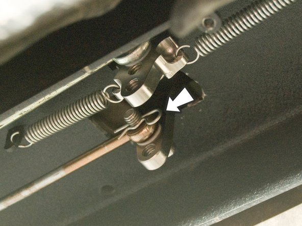 Reinsert one of the supplied cotter pins into the hole at the end of the cable retaining bolt.