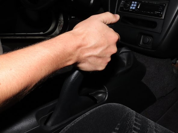 Lift the e-brake handle to the locked position.